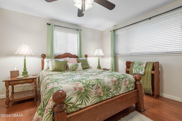 bedroom with ceiling fan and wood-type flooring