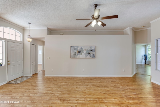 entrance foyer with crown molding, ceiling fan, light hardwood / wood-style floors, and a textured ceiling