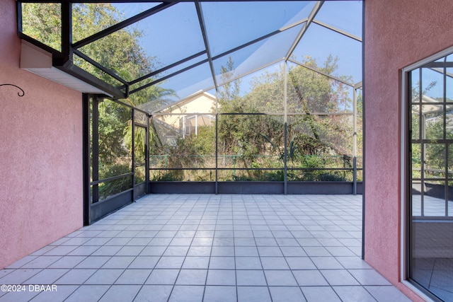 unfurnished sunroom featuring a wealth of natural light