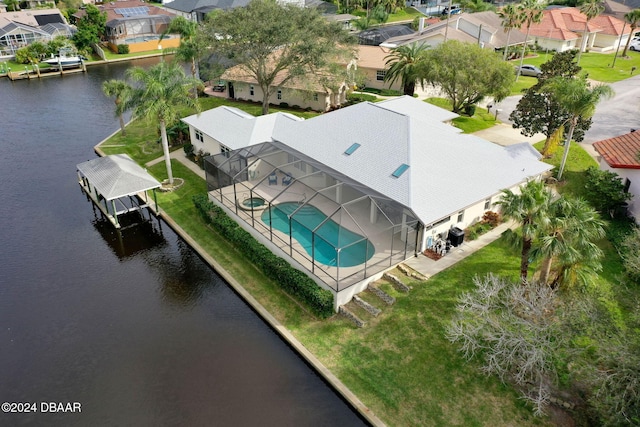 birds eye view of property with a water view