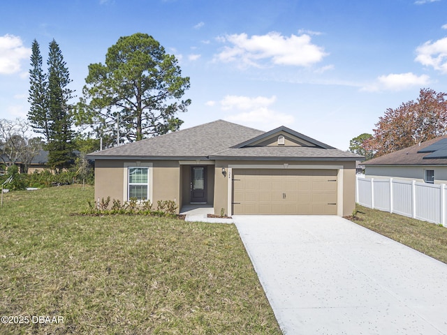 view of front of house featuring a front lawn and a garage