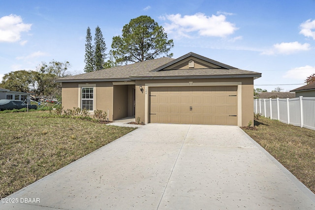 view of front of home with a front lawn and a garage