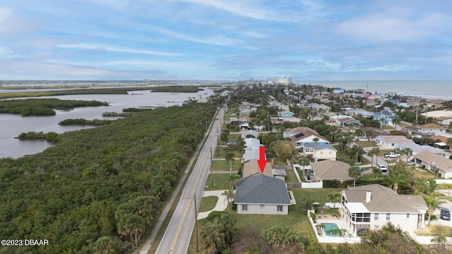 birds eye view of property with a water view