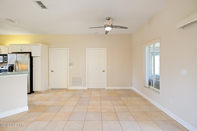 interior space featuring ceiling fan