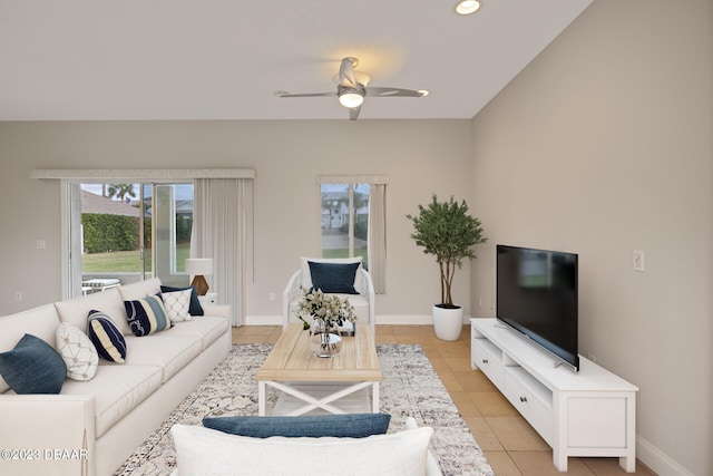 tiled living room featuring ceiling fan