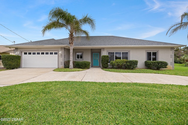 single story home featuring a garage and a front lawn