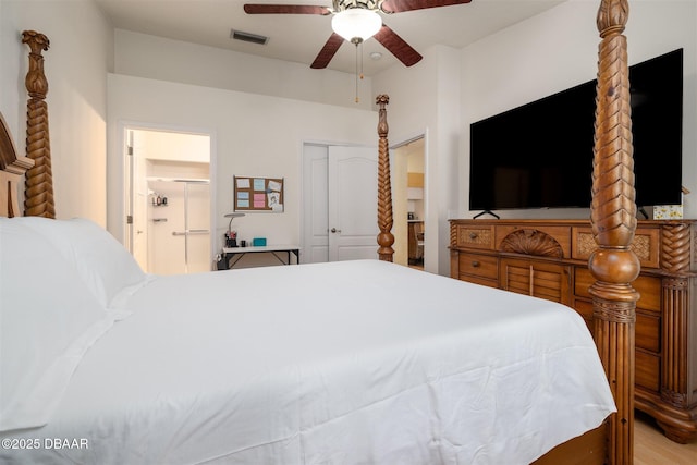 2953 Wild Pecan Ct, Port Orange, FL 32129 - bedroom featuring ceiling fan, connected bathroom, a closet, and wood finished floors