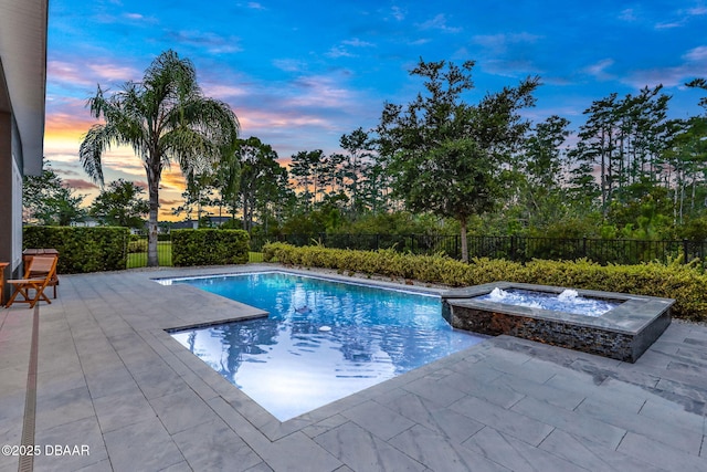 6294 W Fallsgrove Ln, Port Orange, FL 32128 - pool at dusk with a patio area, a fenced backyard, and a pool with connected hot tub