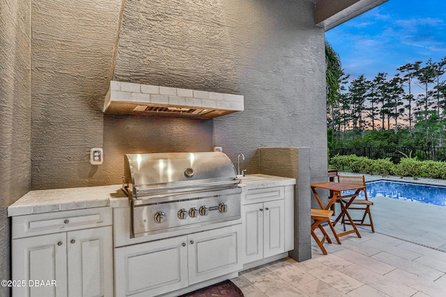 6294 W Fallsgrove Ln, Port Orange, FL 32128 - view of patio / terrace with exterior kitchen and a sink