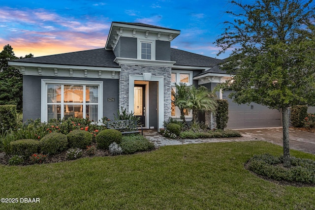 6294 W Fallsgrove Ln, Port Orange, FL 32128 - view of front of property with a front yard, stone siding, concrete driveway, a shingled roof, and stucco siding