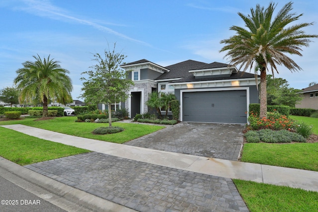 6294 W Fallsgrove Ln, Port Orange, FL 32128 - view of front of house with decorative driveway, a front lawn, stucco siding, and roof with shingles