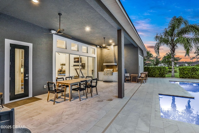 6294 W Fallsgrove Ln, Port Orange, FL 32128 - view of patio with ceiling fan, an outdoor kitchen, and outdoor dining area