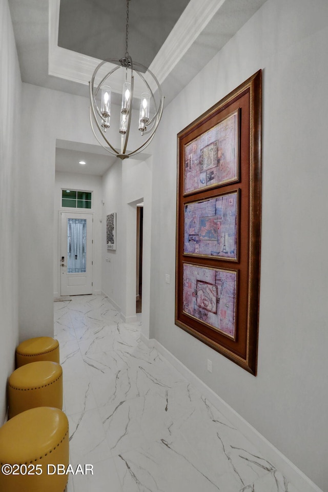 6294 W Fallsgrove Ln, Port Orange, FL 32128 - hall with a chandelier, marble look tile flooring, and a raised ceiling
