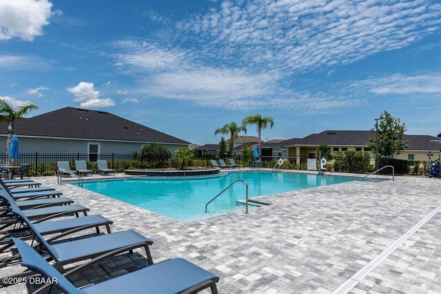 6294 W Fallsgrove Ln, Port Orange, FL 32128 - community pool featuring a patio