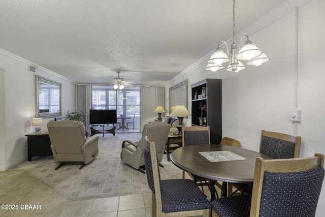 329 Wilder Blvd Unit C103, Daytona Beach, FL 32114 - dining area featuring crown molding, a chandelier, ceiling fan, a textured ceiling, and light tile patterned floors