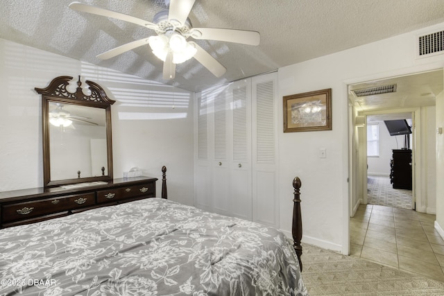 329 Wilder Blvd Unit C103, Daytona Beach, FL 32114 - bedroom featuring light colored carpet, a closet, vaulted ceiling, ceiling fan, and light tile patterned floors