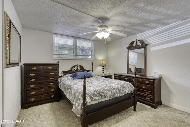 329 Wilder Blvd Unit C103, Daytona Beach, FL 32114 - bedroom with baseboards, a textured ceiling, and a ceiling fan