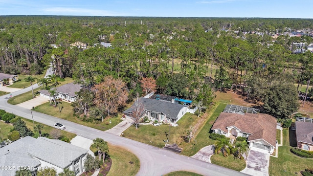 bird's eye view featuring a residential view and a view of trees