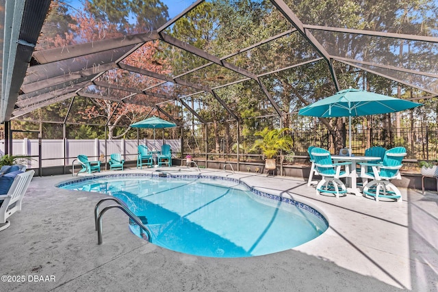 view of swimming pool with a lanai, a fenced backyard, a fenced in pool, and a patio