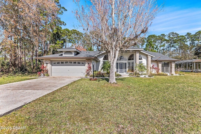 view of front facade with a garage, a front yard, and driveway