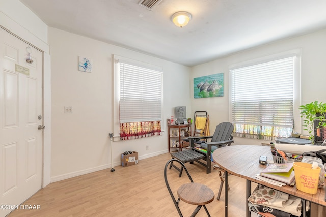 office space with light hardwood / wood-style flooring