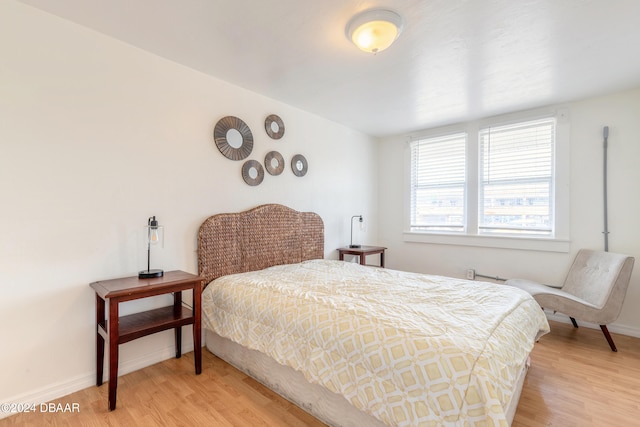 bedroom with light hardwood / wood-style flooring