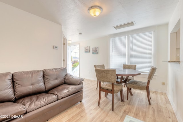 dining area with light wood-type flooring