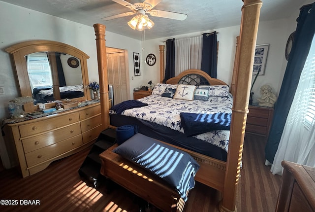 bedroom with ceiling fan, dark hardwood / wood-style flooring, a closet, and decorative columns