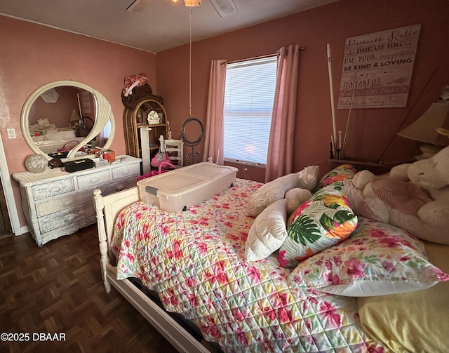 bedroom featuring ceiling fan and dark parquet floors