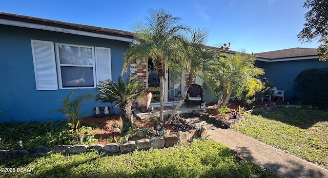 exterior space with a front lawn