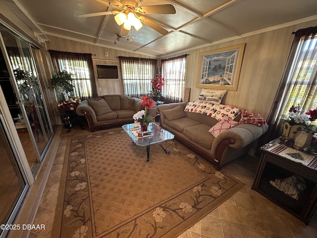 living room featuring ceiling fan and coffered ceiling