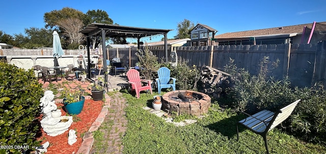 view of yard with a patio area and an outdoor fire pit