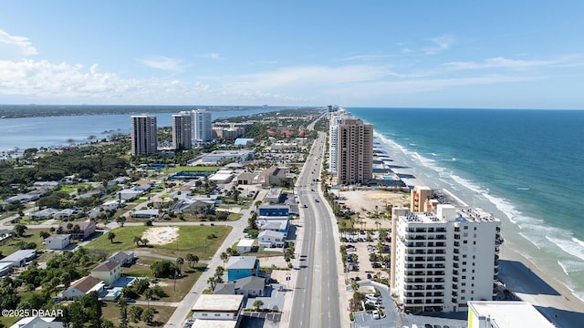 bird's eye view featuring a water view and a view of the beach