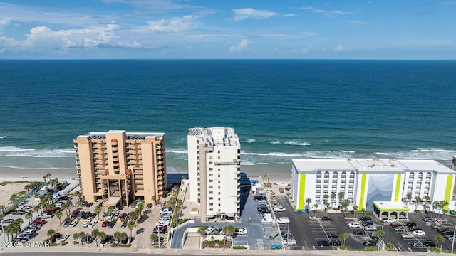 aerial view featuring a water view and a beach view