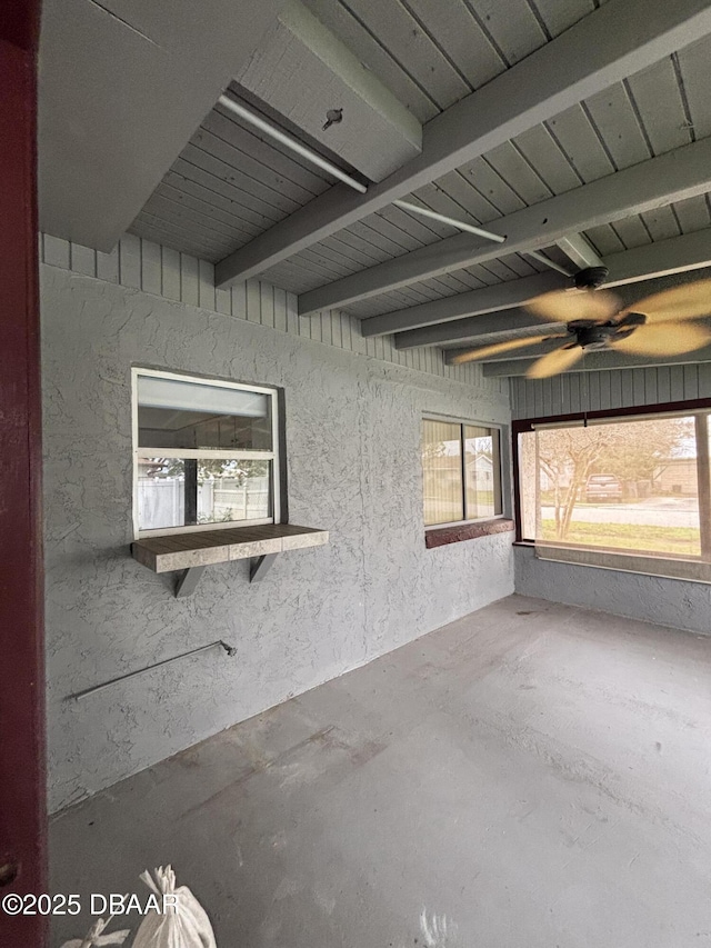 interior space featuring beam ceiling