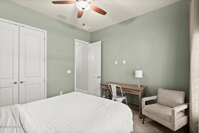 carpeted bedroom featuring a closet and ceiling fan