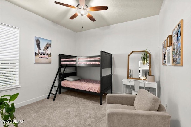 bedroom featuring ceiling fan and light carpet