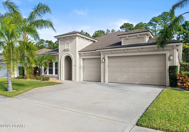 mediterranean / spanish home featuring a garage