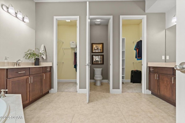 bathroom featuring tile patterned floors and vanity