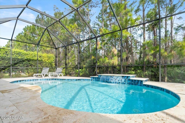 view of pool with a lanai and pool water feature