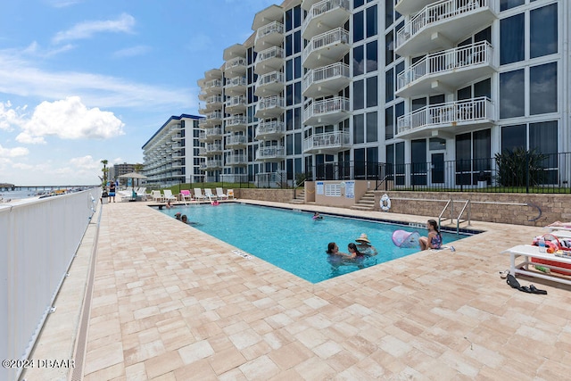 view of pool featuring a patio