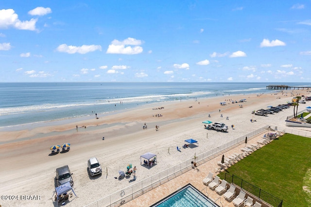 aerial view featuring a view of the beach and a water view