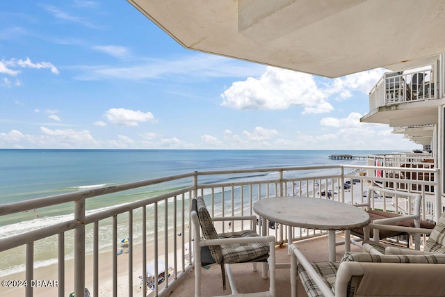 balcony with a view of the beach and a water view