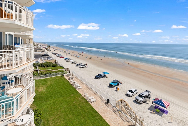 bird's eye view featuring a beach view and a water view