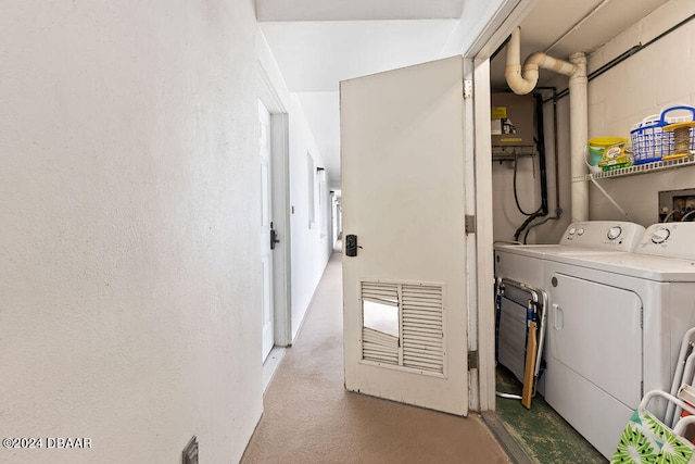 laundry area featuring light colored carpet and independent washer and dryer