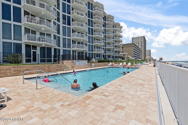 view of swimming pool featuring a patio