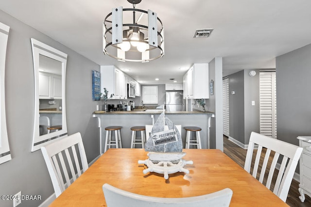 dining area with hardwood / wood-style floors