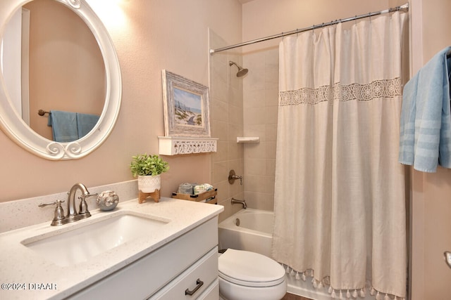 full bathroom featuring shower / bath combo, vanity, and toilet