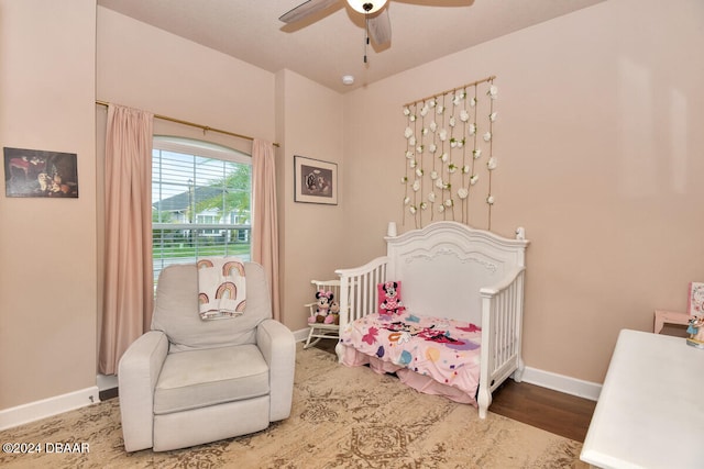 bedroom with ceiling fan and wood-type flooring