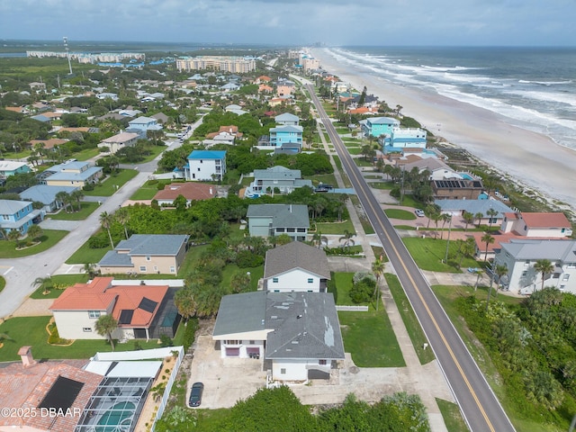 aerial view with a water view, a residential view, and a view of the beach